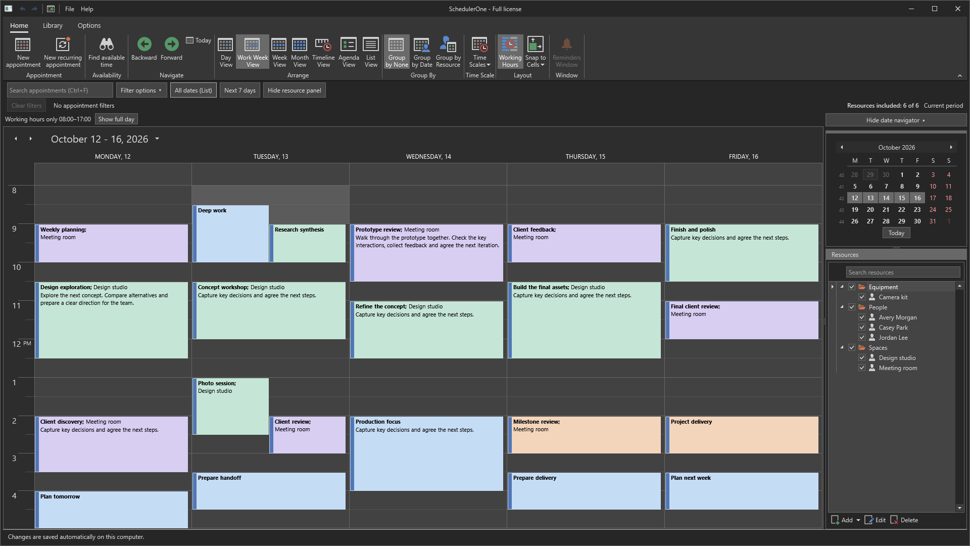 SchedulerOne Work Week view in a dark theme with color-coded appointment cards.
